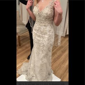 Maggie Sottero Ivory over light gold with pewter details  “Greer” wedding dress
